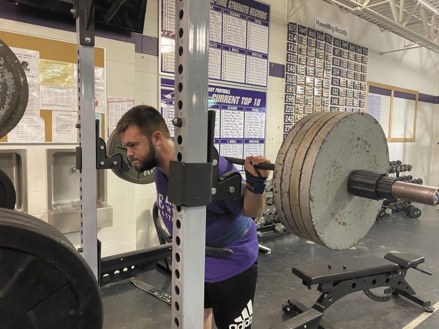 Sophomore Gage Higgs lifts 405 pounds at his practice for the upcoming state meet. “I’m only as good as my last broken record; I have been doing this for so long that powerlifting has become more than a sport to me - it’s a lifestyle,” Higgs said. 