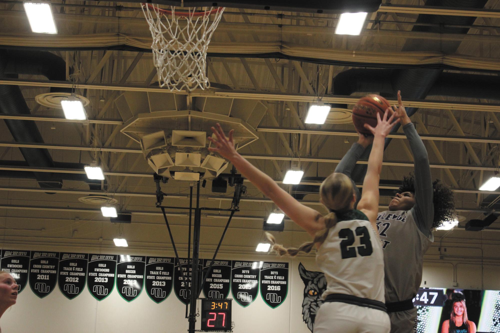 Take it to the net. In the last minutes of the game, junior Jamyla Gilmore scores a layup.“I was in a concentrated mindset because I was scoring against one of the top ranked girls in the state,” Gilmore said.