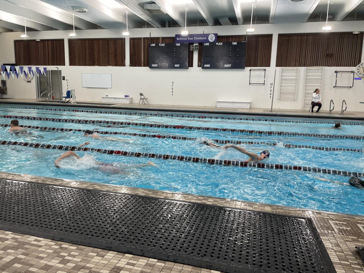 Splash! Every day after school the Bellevue East swim team joins Platteview for practices in East’s pool.The team practices for around two hours a day. While practice is requires a lot of effort from the swimmers, swimmers say that the team has a fun and supportive environment. “The coach is always supporting you, always got your back, and whenever you’re in the meet, and you’re going, you just have the entire swimming team shouting at you,‘go, go, go,’” sophomore Conway Keubler said.