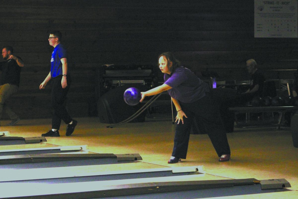 Rolling In. At a bowling tournament on Nov. 7, in which East com- peted, junior Rose Gallagher approaches her lane, ready to roll the ball into the pins for a strike. She described what she was thinking in the moment. “In my mind I think ‘I can get a strike, I can get a strike, I can get a strike,” Gallagher said. 