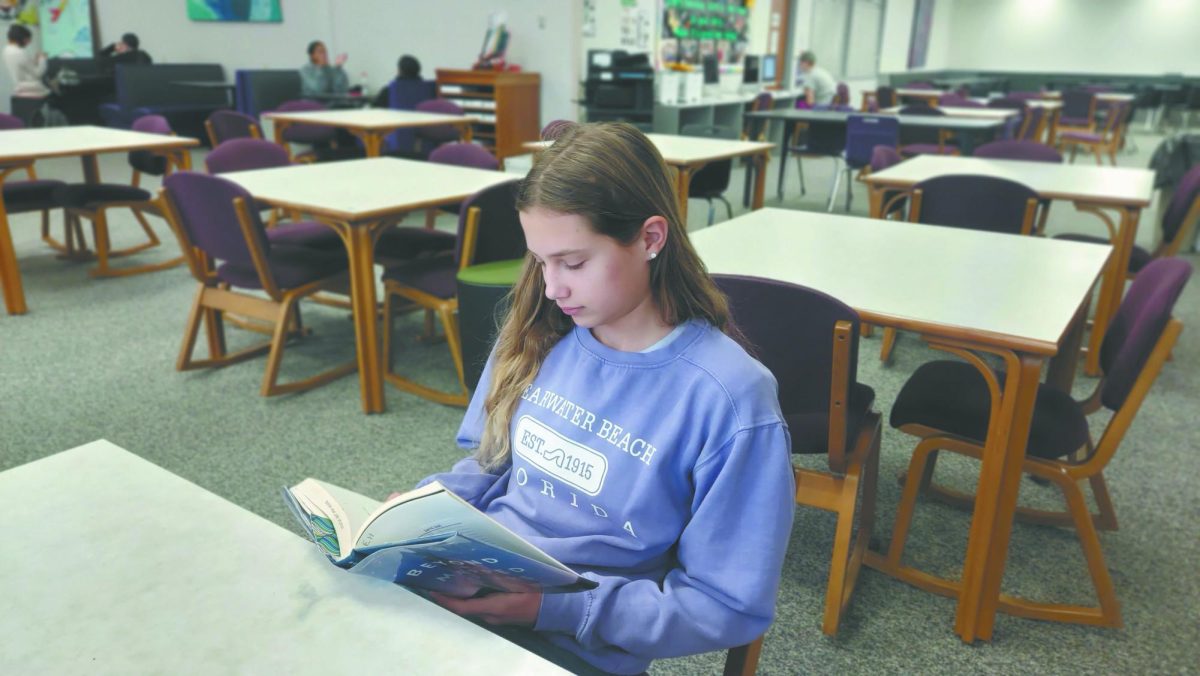 Can’t put it down. Sitting at a table in the Bellevue East library, freshman Charlotte Palm reads the novel “Beyond the Mapped Stars” by Rosalyn Eves. She started the book two days prior as part of the library’s book challenge. “I’ve read four of the eight books so far... I think reading is important because it can expand your vocabulary and experiences that you’ve had,” Palm said.