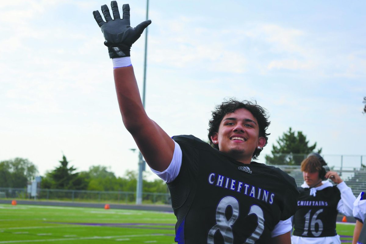 Let’s win. Running across the field, senior Erick Gomez waves to his friends in the stands. The Bellevue East football team had a winning 2023-24 season and celebrated their victory afterwards. “It’s always been fun, and we all really just work together to do our best,” Gomez said.