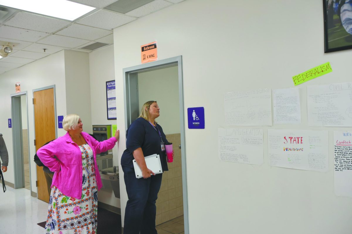 Supervising. Monitoring the girls restroom, Instructor Rebekah Sidzyik [LEFT] and instructor Shelly McCarty
[RIGHT] make sure students are safe in the restroom area and that they get to class on time. All teachers have to
monitor the restrooms starting this school year. "Well, it’s not what I got all my degrees for, but you know safety of
students is a probably tied with educating them so if things are unsafe in the bathroom them we probably should
be in there," Sidzyik said. 
