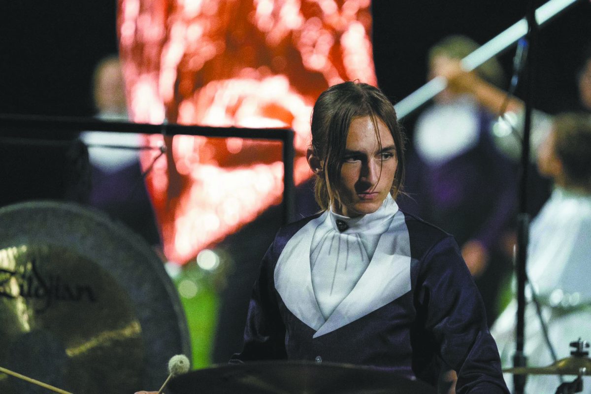 Staying in rhythm. Performing during the marching band season, junior Daelan Bauer plays in the drum line. As they make their way into college in the next few years, they plan to continue with band. “Something I’m looking for in college would be to further expand my knowledge as a musician not only as a performer but also as a composer,” Bauer said. 
Photo courtesy of Daelan Bauer