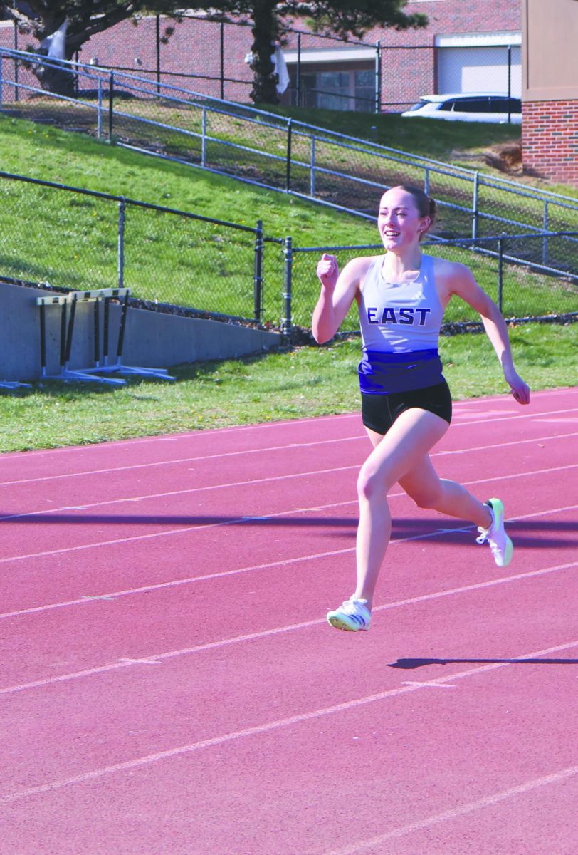 All smiles down the stretch. Sprinting down the track is senior Brynn Friedrich, showing both determination and enjoyment as she competes. Friedrich is a sprinter for the team and continues to push herself and her teammates to improve each meet. “Teamwork is helping those who need help” Friedrich said. 