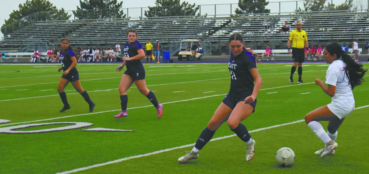 Rise to the challenge. Watching her teammate, Varsity Captain Senior Bailey Jones reminds herself of the female leadership encouragement by her coaches. The new all-female Girls Soccer coaching team encourages confidence in their players. " Once I start overthinking about a game I don’t play with confidence and I need to be confident so I am able to show up for my team," Jones said. "Then just keeping everyone positive during drills and pushing everyone to work hard at practice because that’s how we prepare for our upcoming games." 