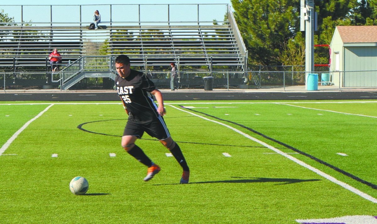 Pass the ball. During a JV boys soccer game, sophomore Dominic Arvizu kicks and passes the ball to his other teammates in hopes to get a goal. Bellevue East went against Omaha Northwest’s team and put their communication and teamwork skills to the test. “I’m trying to pass it up and see if someone is open so they can do something to try to score,” Arvizu said. 